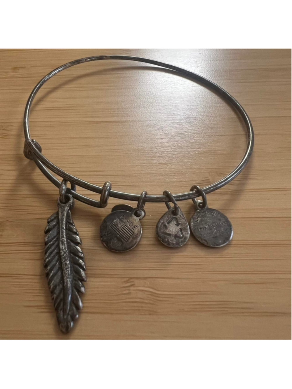 Silver Alex and Ani feather charm bangle bracelet